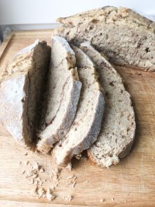 sourdough bread sliced up on a cutting board
